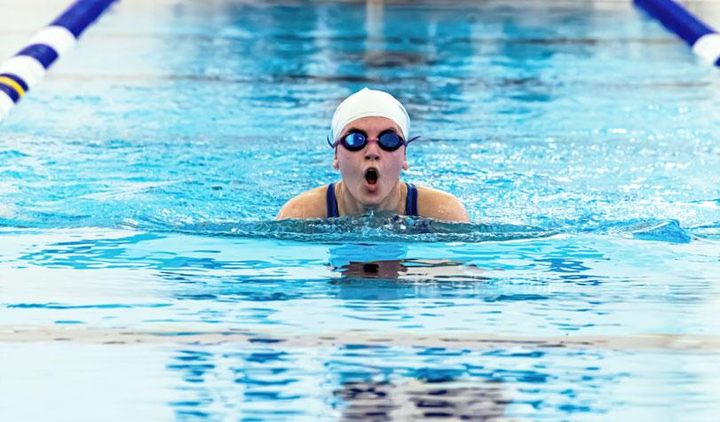 Woman swimmer coming up for a breath